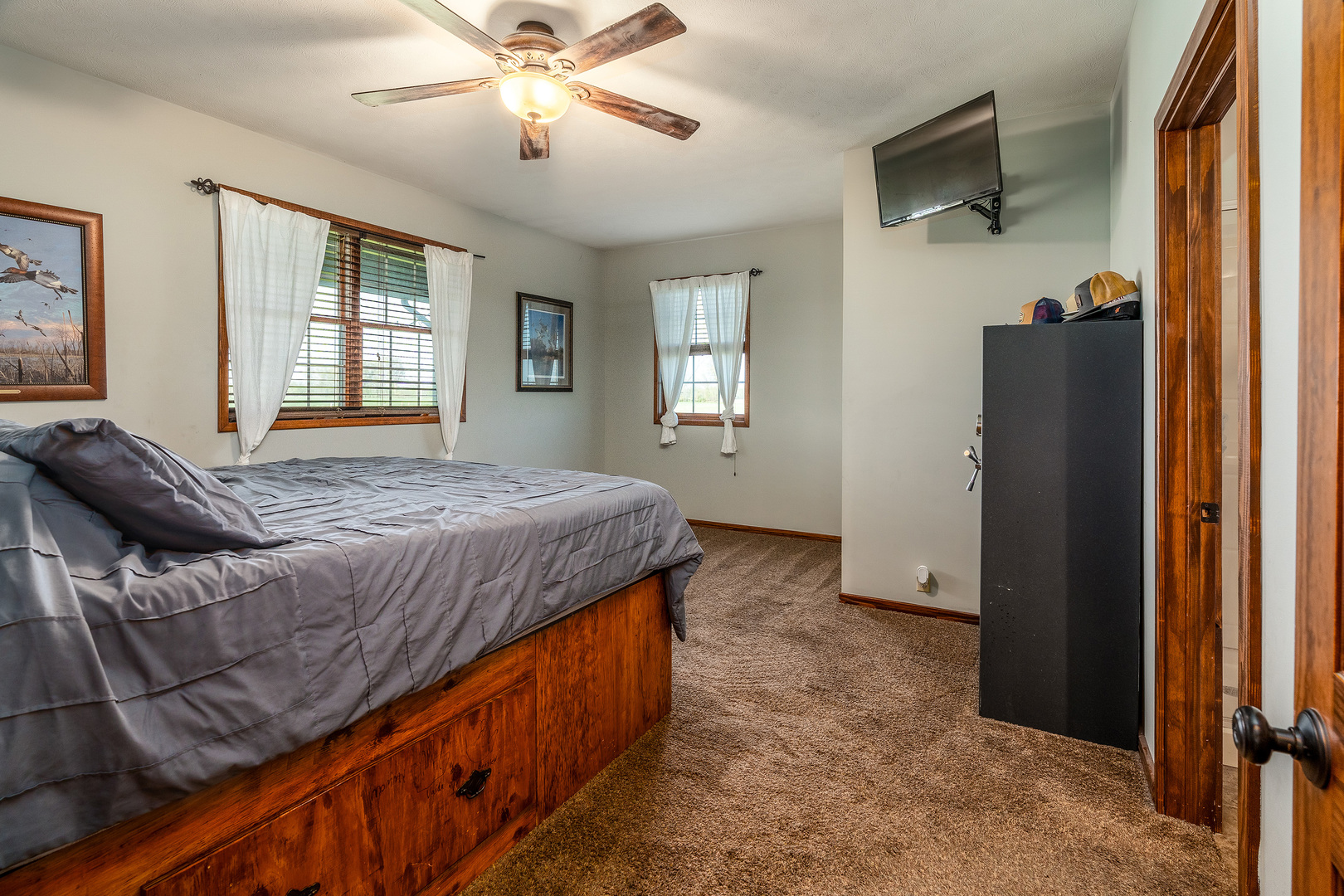 9242 East Park Street Road Du Quoin, IL 62832 - Photo 16 of 44 a bedroom with a bed and a chandelier