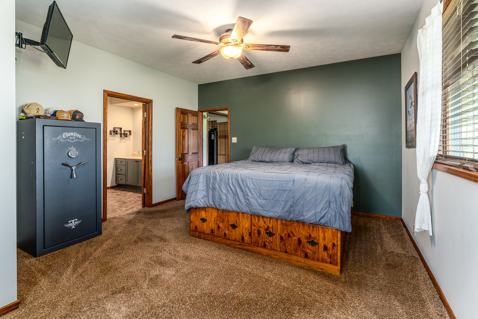 9242 East Park Street Road Du Quoin, IL 62832 - Photo 17 of 44 a bedroom with a bed and a chandelier