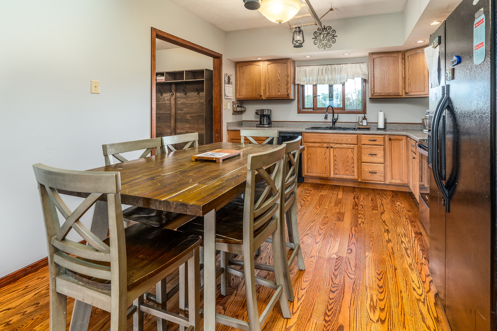 9242 East Park Street Road Du Quoin, IL 62832 - Photo 9 of 44 a kitchen with a table chairs refrigerator and microwave