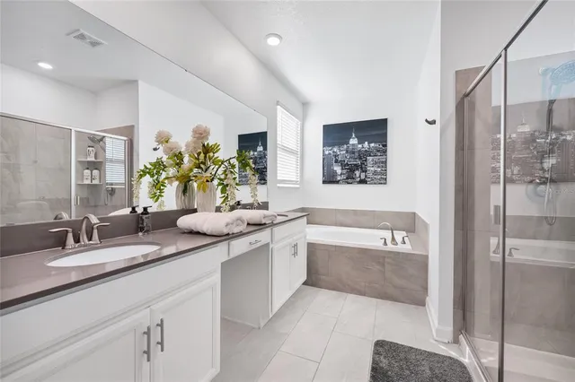 a view of living room filled with furniture and a potted plant