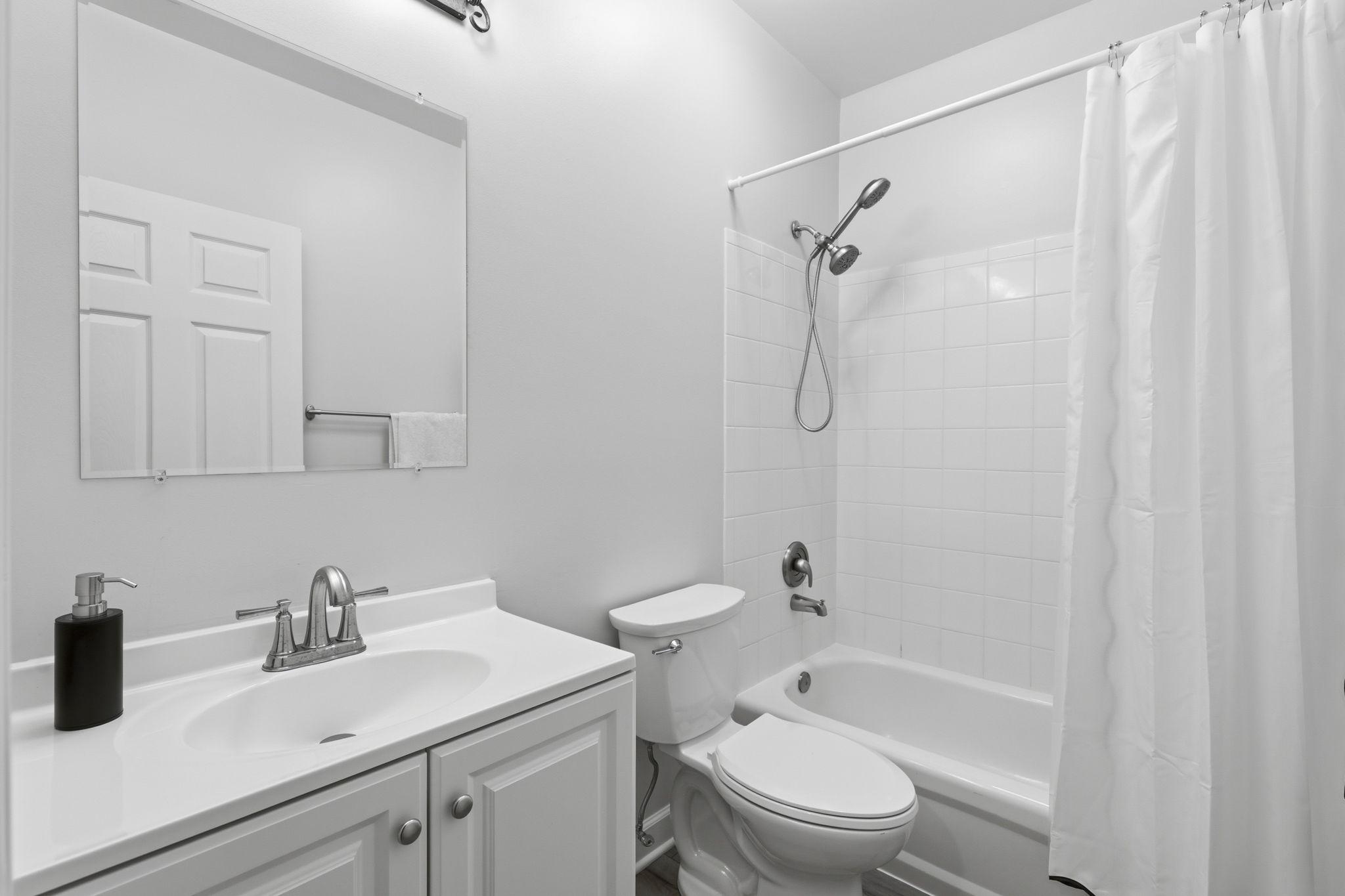 11509 Summit Ridge Court Manassas, VA 20112 - Photo 36 of 43 a bathroom with a sink a toilet and shower