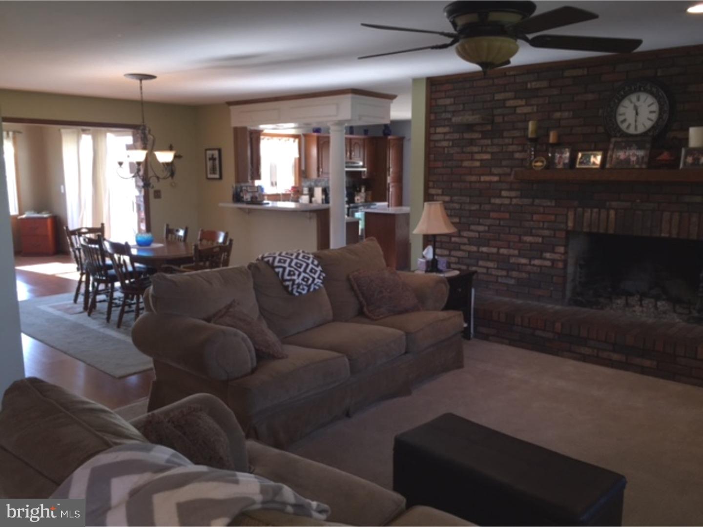 210 Shoemaker Road Bridgeton, NJ 08302 - Photo 13 of 22 a living room with furniture and a fireplace