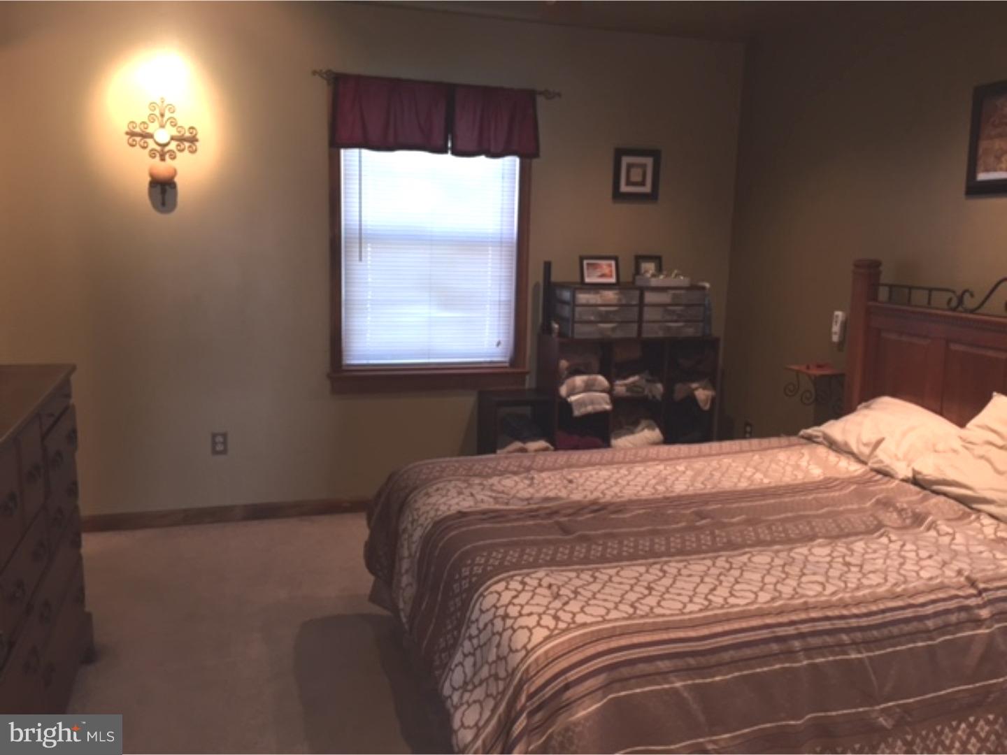 210 Shoemaker Road Bridgeton, NJ 08302 - Photo 14 of 22 a bedroom with a bed and a window