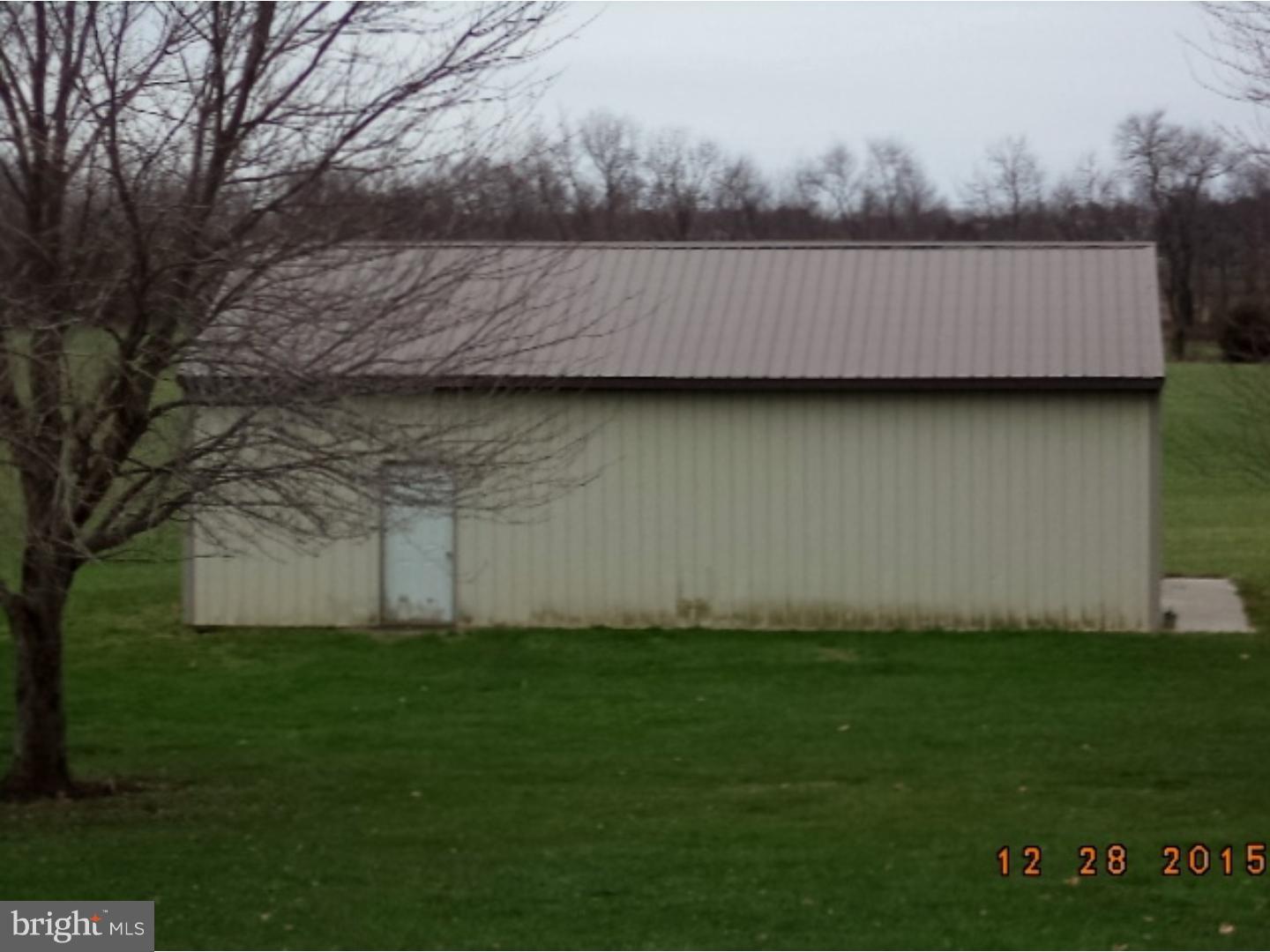 210 Shoemaker Road Bridgeton, NJ 08302 - Photo 22 of 22 a view of a backyard with barn
