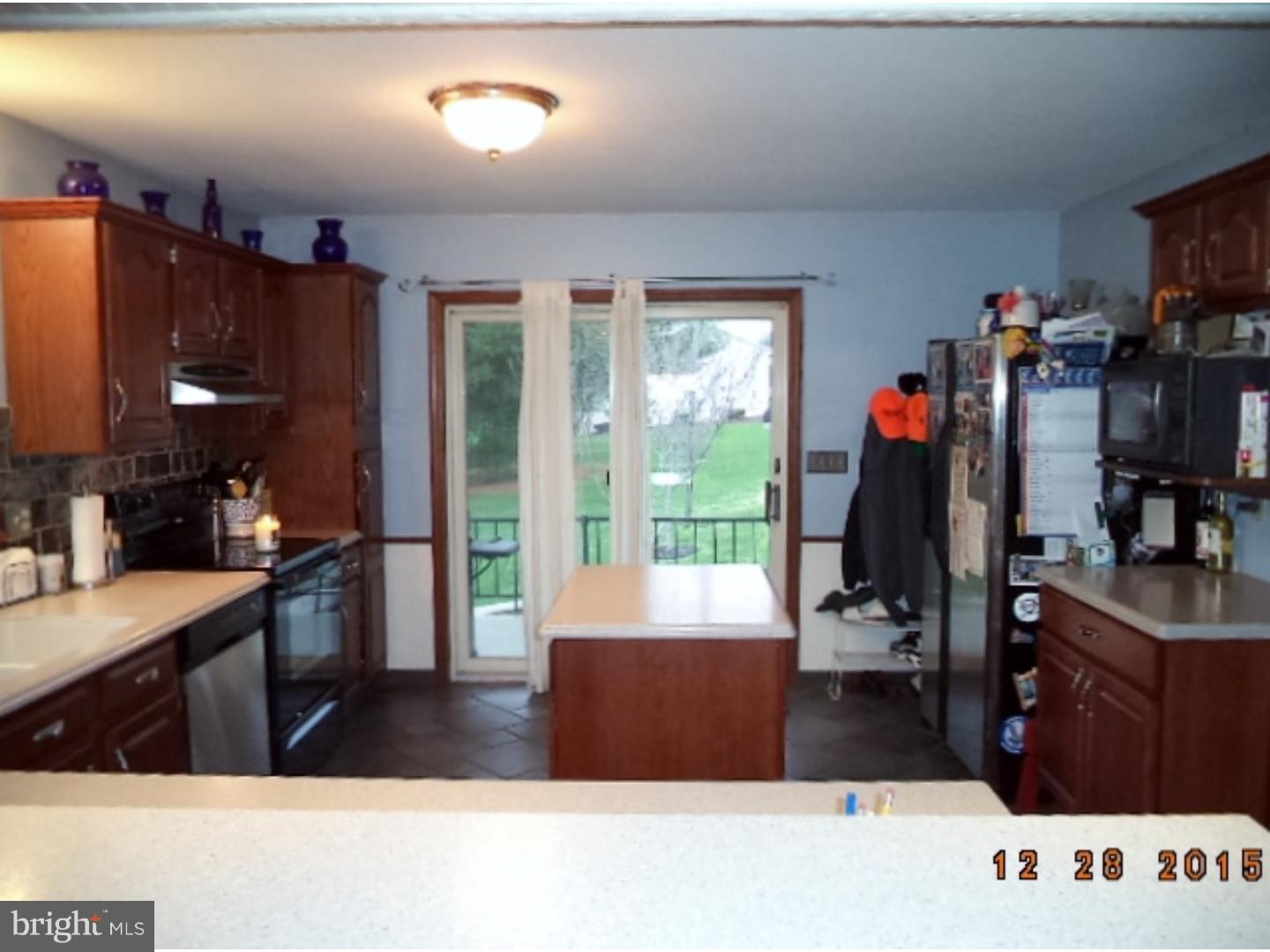 210 Shoemaker Road Bridgeton, NJ 08302 - Photo 5 of 22 a living room with stainless steel appliances kitchen island granite countertop a refrigerator stove and sink