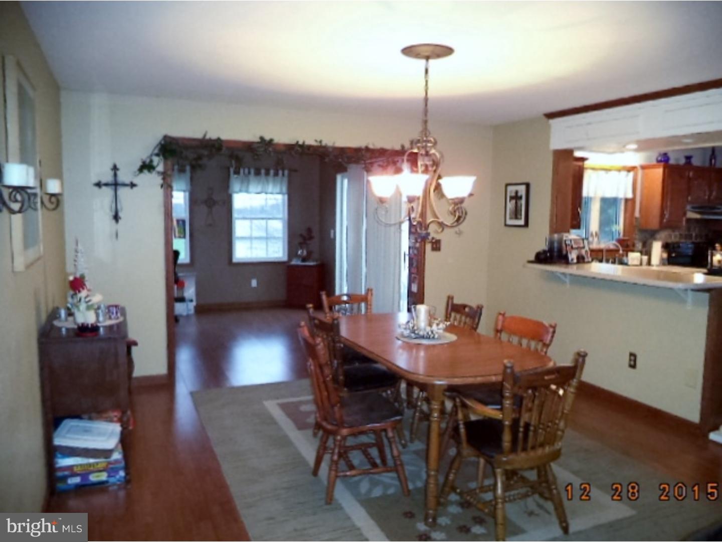 210 Shoemaker Road Bridgeton, NJ 08302 - Photo 7 of 22 a dining room with furniture and wooden floor