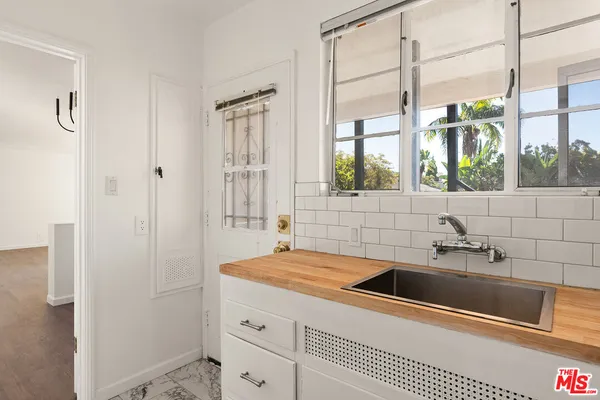a bathroom with a sink and a window