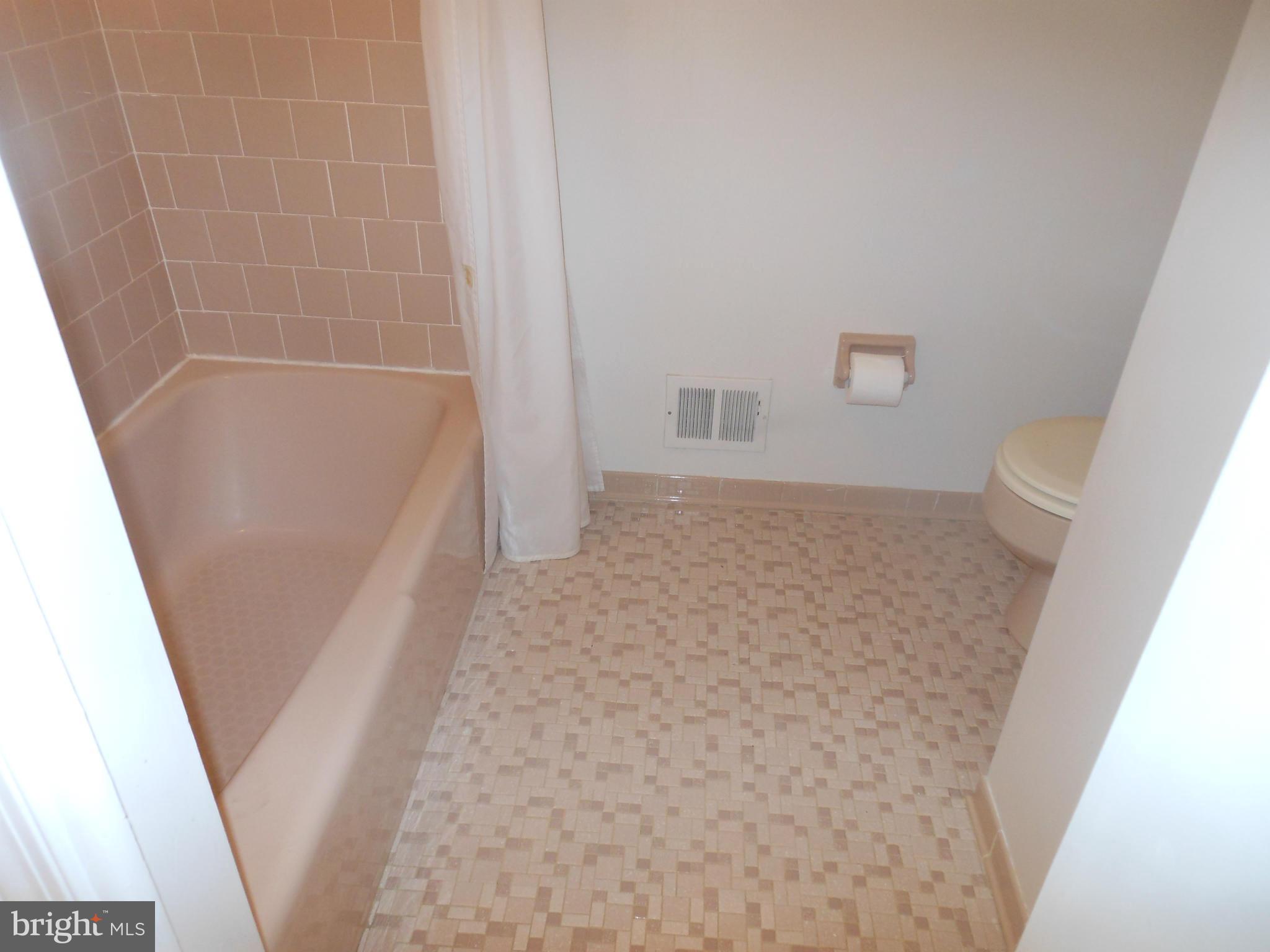 1705 Gamewell Road Silver Spring, MD 20905 - Photo 8 of 28 a bathroom with a sink a toilet a shower and a mirror