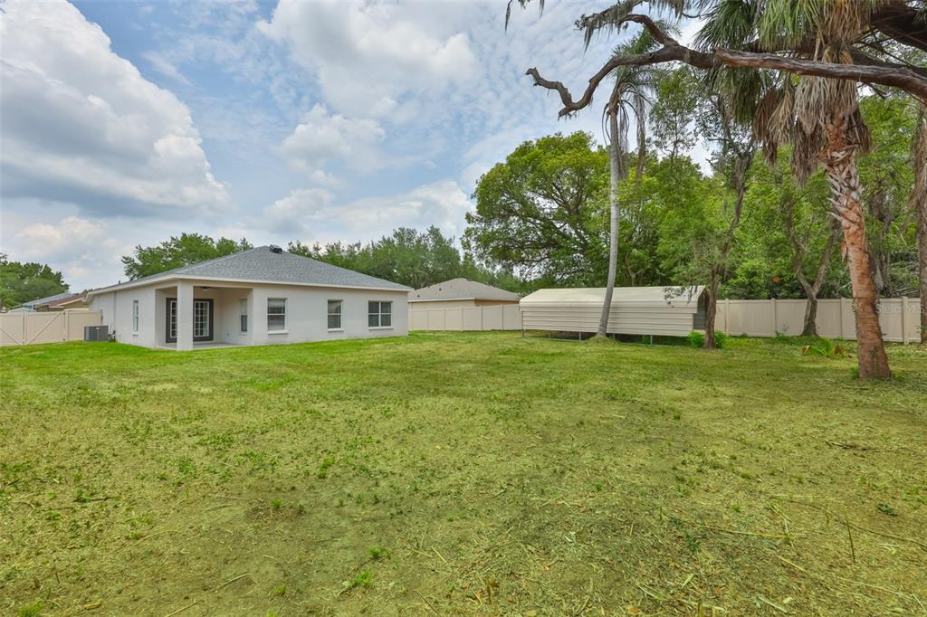 708 Coade Stone Drive Seffner, FL 33584 - Photo 37 of 48 a front view of a house with a yard
