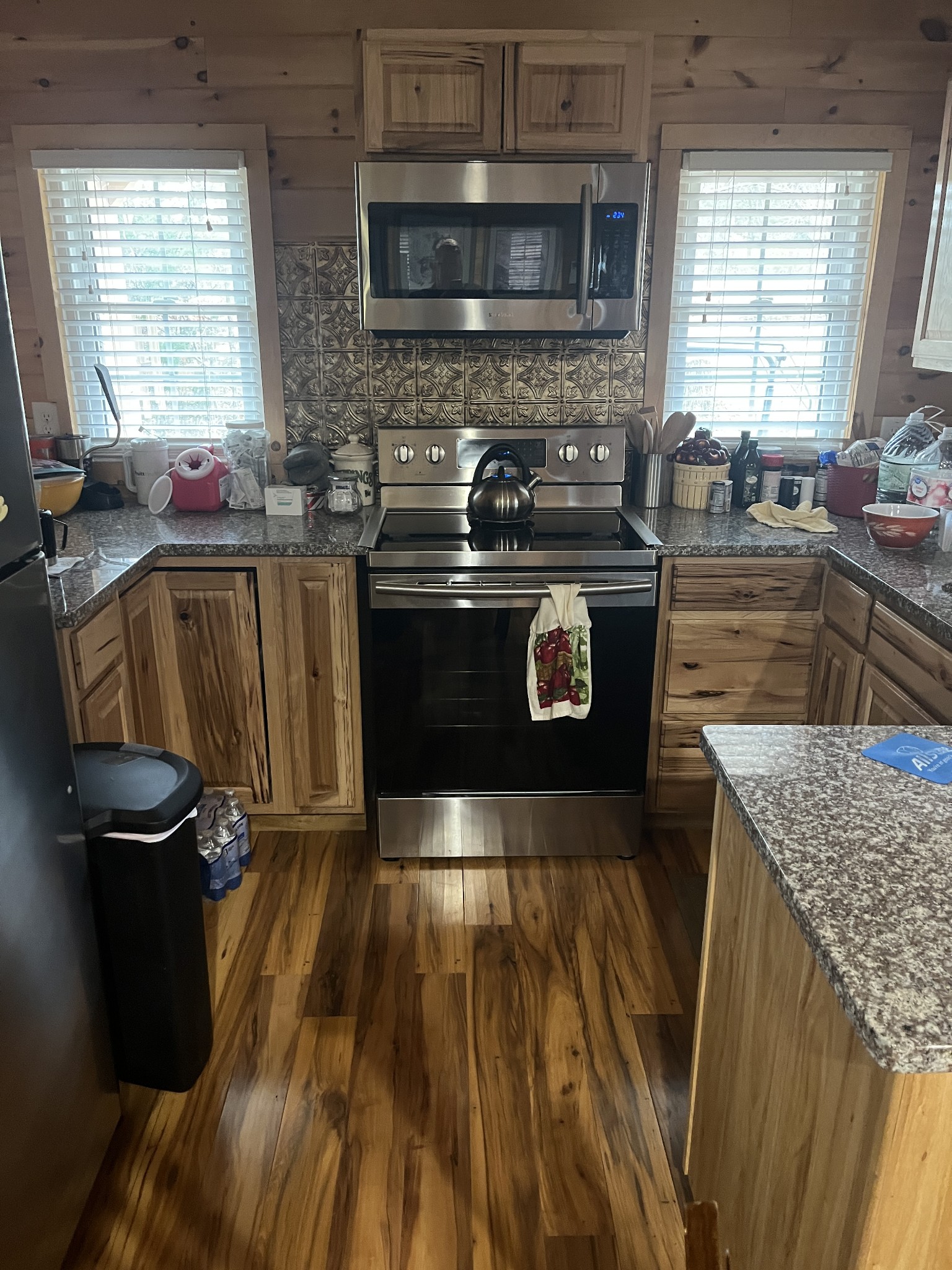 2694 Sims Road Shelbyville, TN 37160 - Photo 7 of 10 a kitchen with granite countertop a stove a sink and a microwave