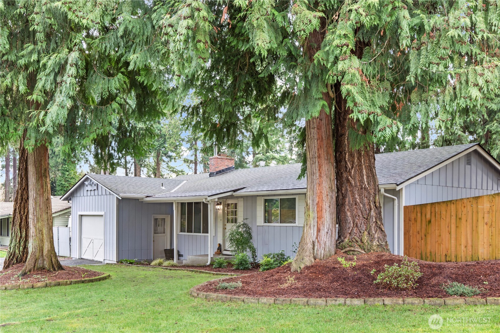 203 South 357th Street Federal Way, WA 98003 - Photo 1 of 28 a front view of a house with a yard and tree