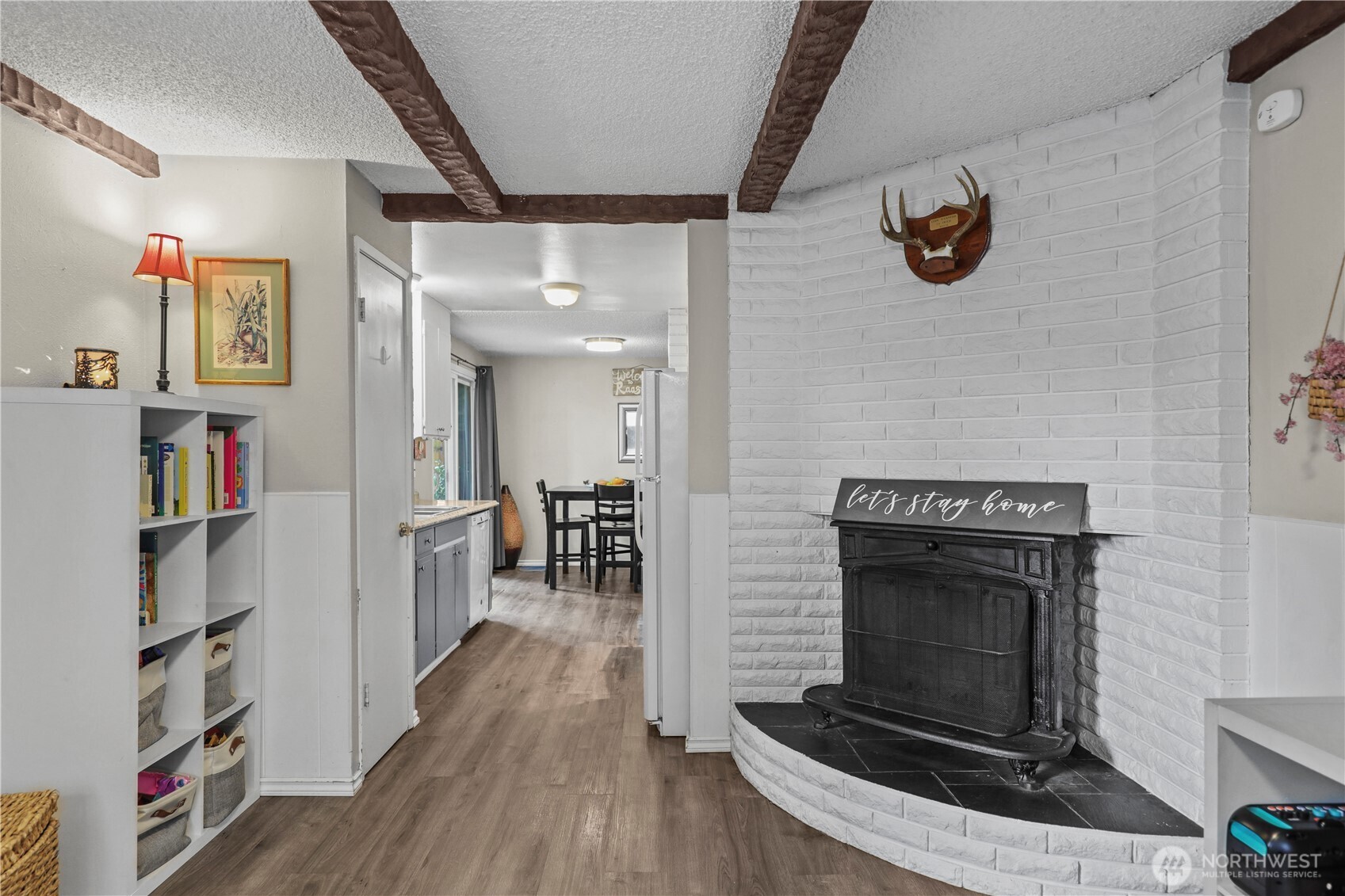 203 South 357th Street Federal Way, WA 98003 - Photo 14 of 28 a hallway with wooden floor fireplace and a window