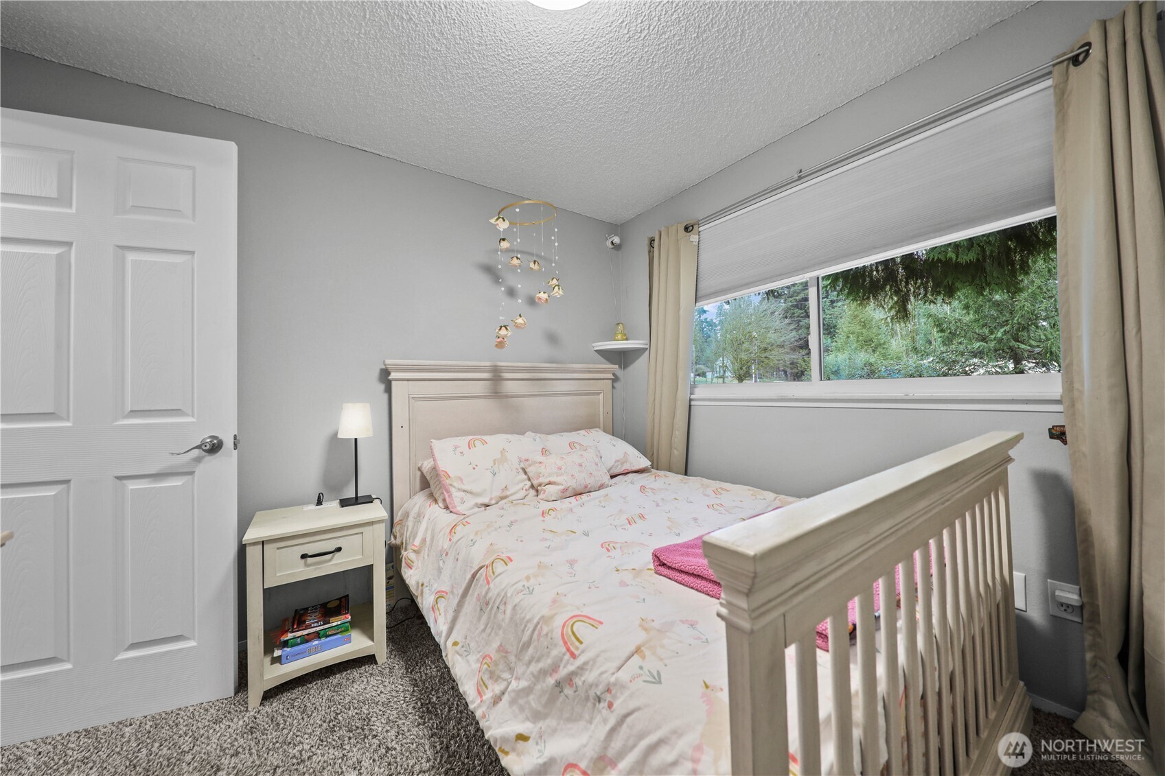 203 South 357th Street Federal Way, WA 98003 - Photo 15 of 28 a bedroom with a bed and a window