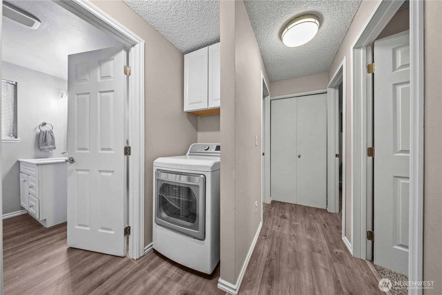 203 South 357th Street Federal Way, WA 98003 - Photo 21 of 28 a view of a storage and utility room with wooden floor