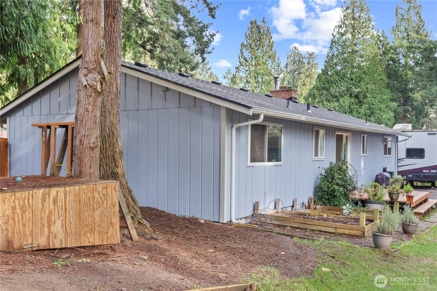 203 South 357th Street Federal Way, WA 98003 - Photo 25 of 28 a view of a house with backyard and sitting area