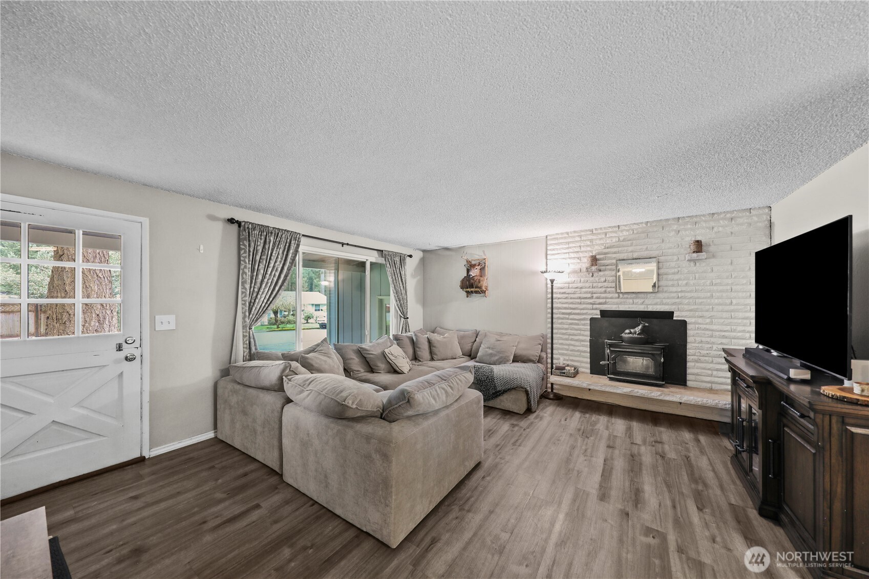 203 South 357th Street Federal Way, WA 98003 - Photo 5 of 28 a living room with furniture and a flat screen tv