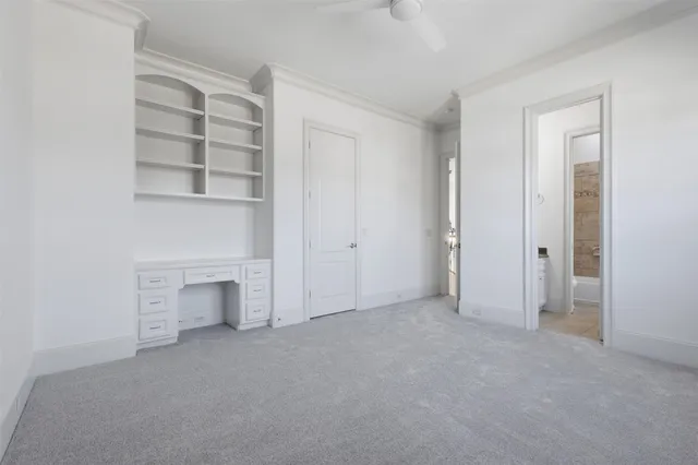 a view of an empty room with a fireplace
