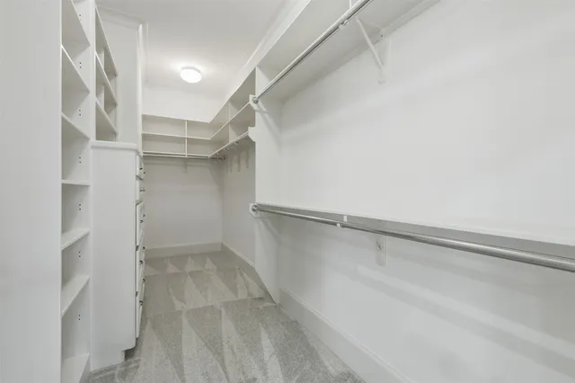 a view of an empty walk in closet