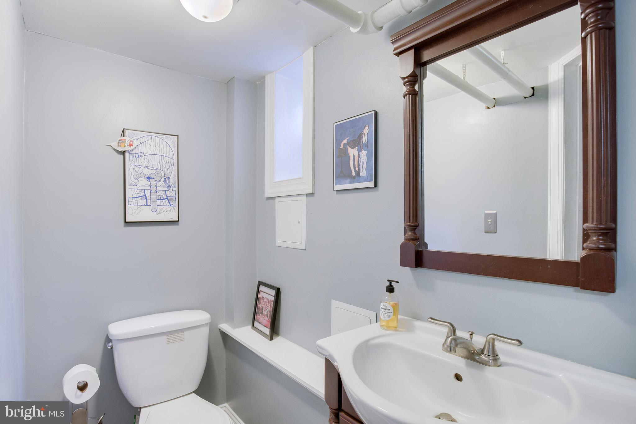 4108 Evans Chapel Road Baltimore, MD 21211 - Photo 23 of 26 Renovated half bathroom.