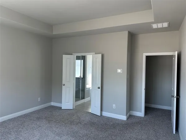 an empty room with closet area