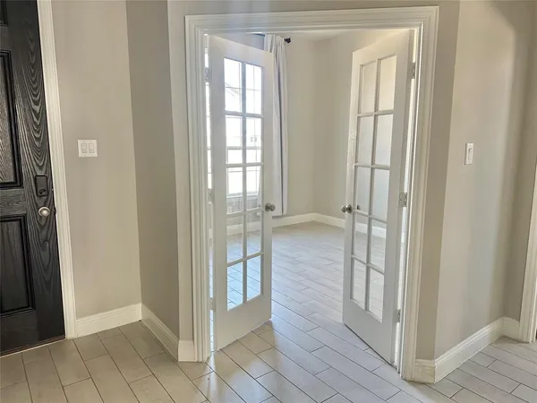 a view of a bathroom with wooden floor