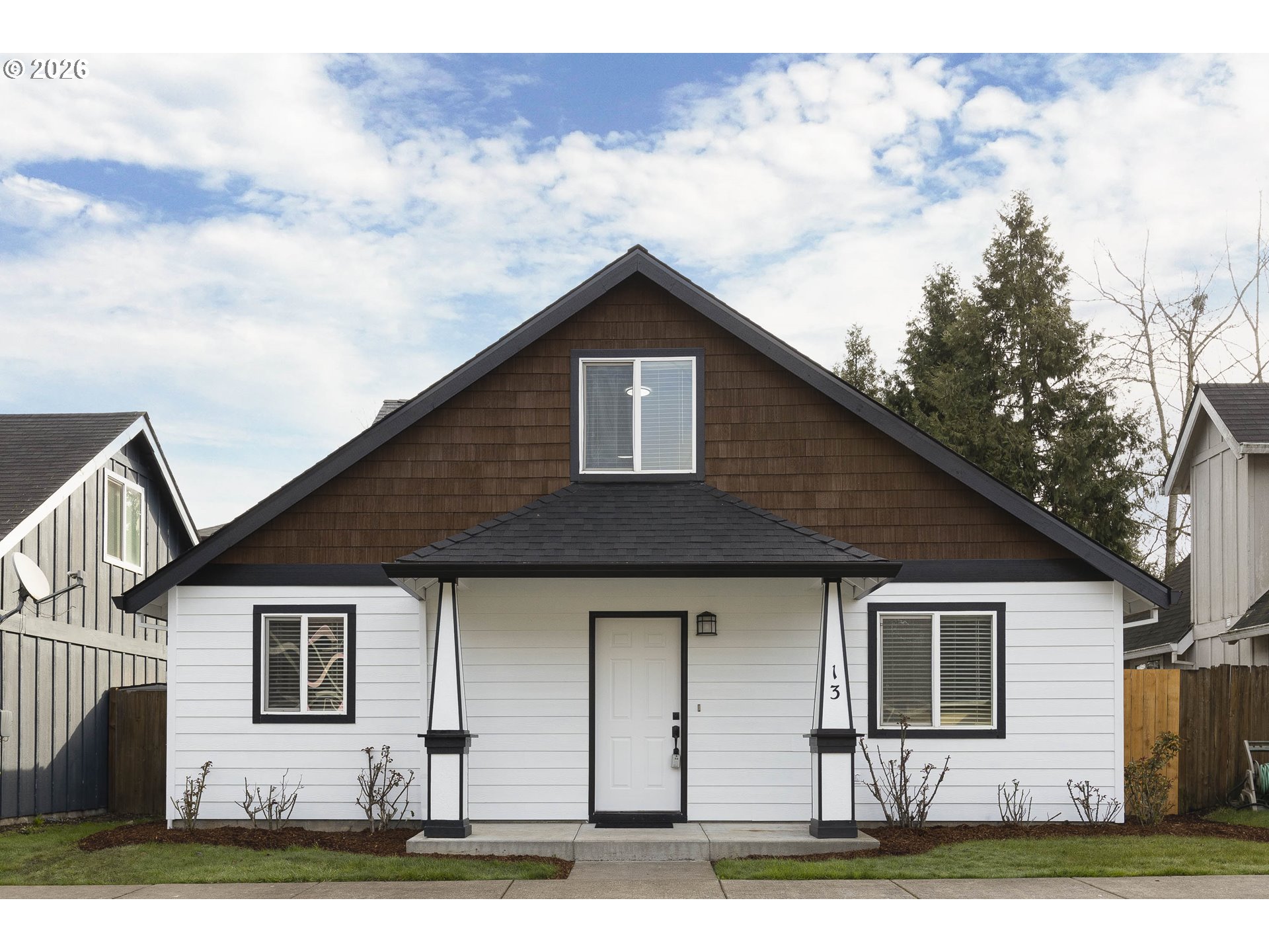 a front view of a house with yard