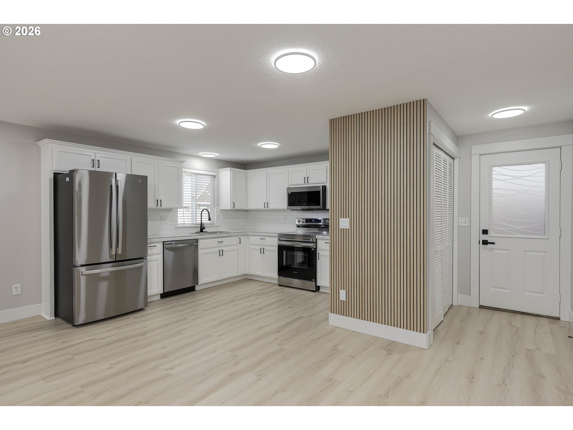 601 West 1st Street, Unit 13 Newberg, OR 97132 - Photo 5 of 30 a kitchen with a refrigerator and a sink