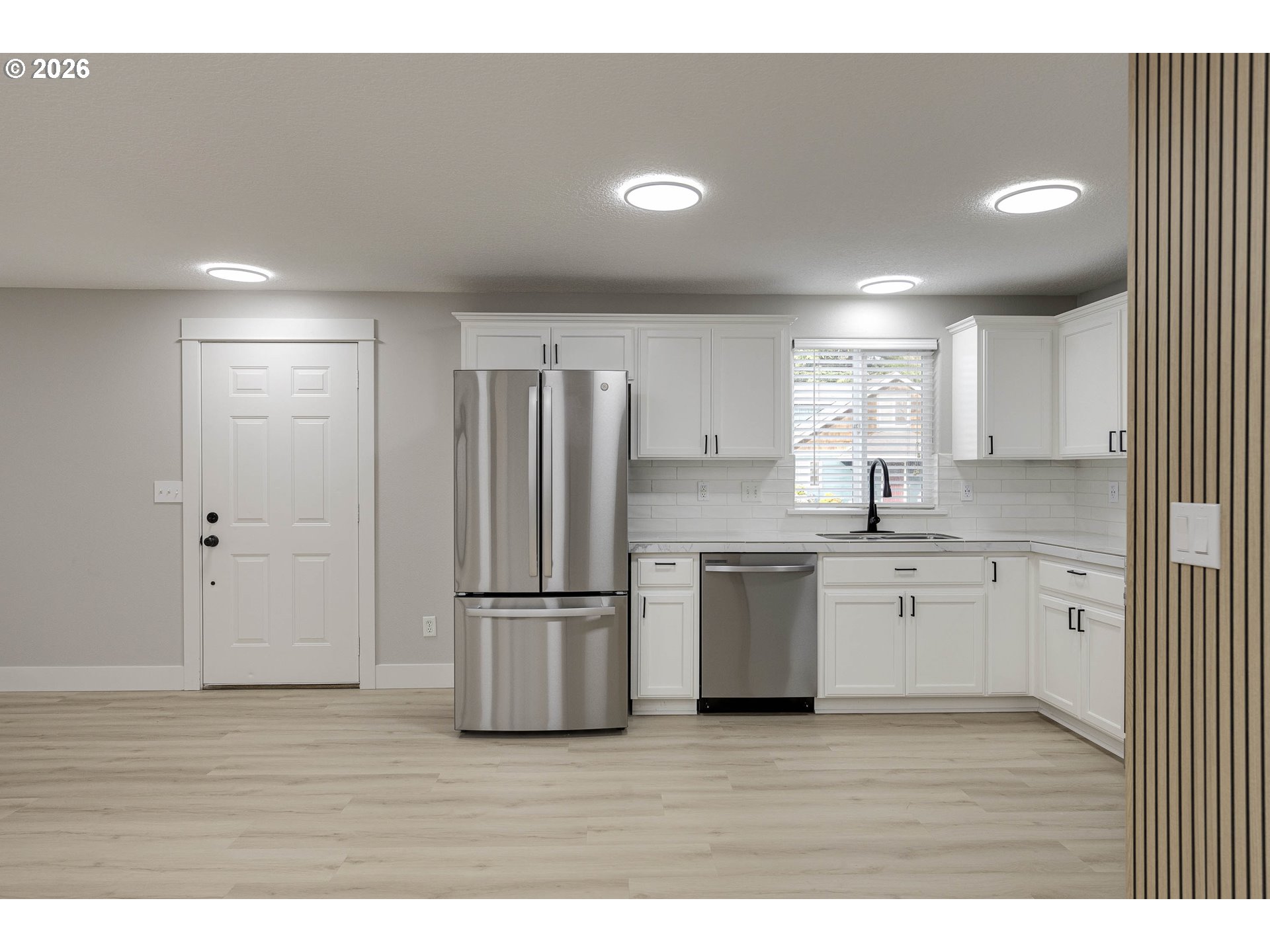 601 West 1st Street, Unit 13 Newberg, OR 97132 - Photo 6 of 30 a kitchen with refrigerator and cabinets