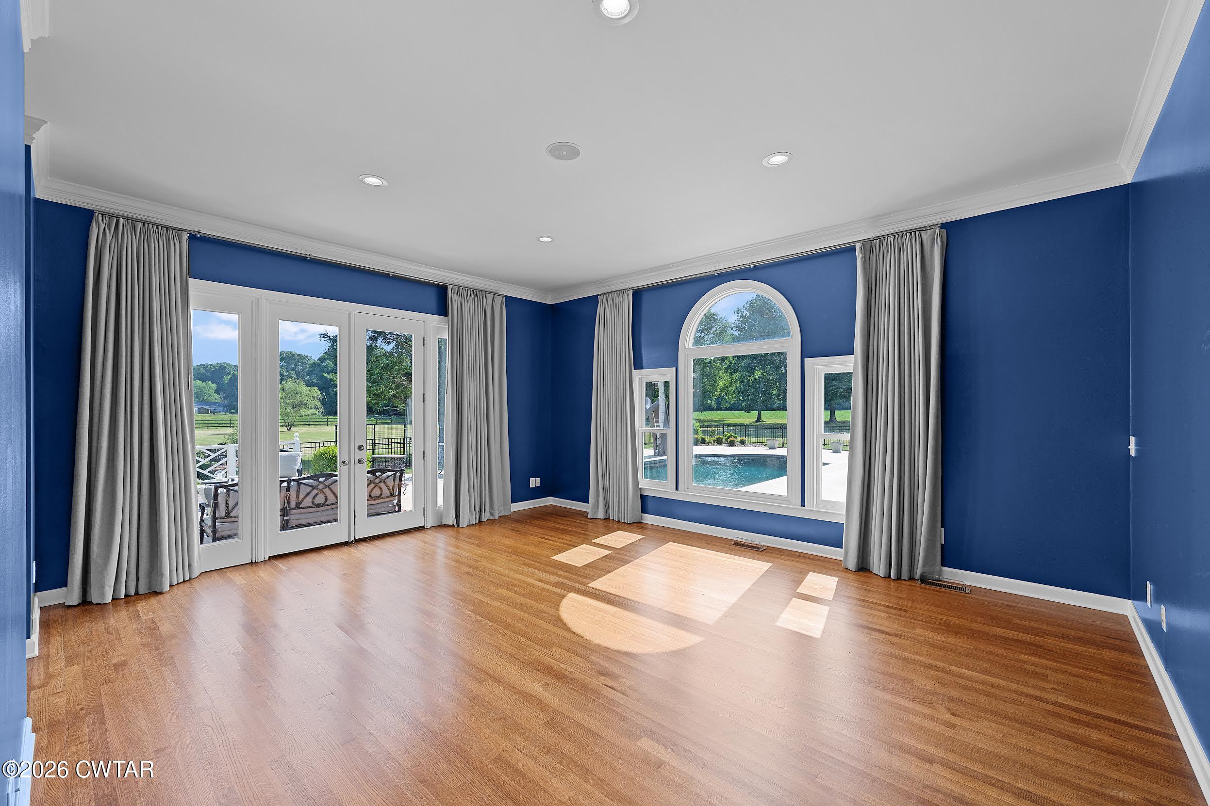 58 Huntington Place Jackson, TN 38305 - Photo 20 of 38 a view of an empty room with wooden floor and a window