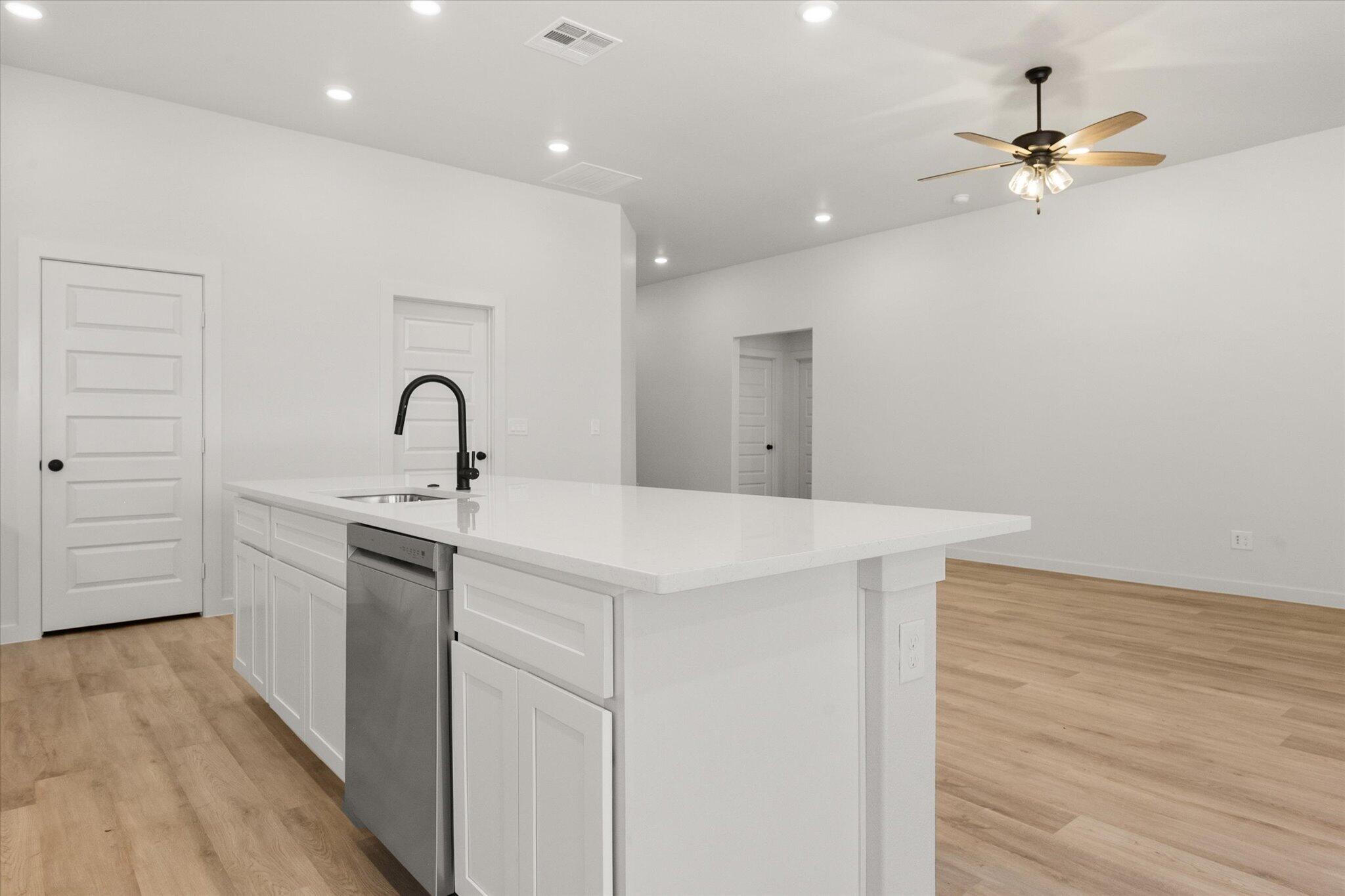 1203 East 30th Street Wolfforth, TX 79382 - Photo 11 of 25 a very nice looking room with a wooden floor