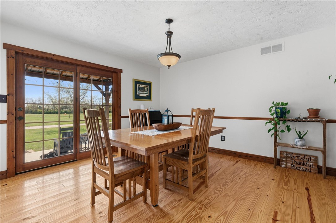4971 Lackey Road Cedarville, OH 45314 - Photo 29 of 79 This bright dining area features warm hardwood floors and abundant natural light.