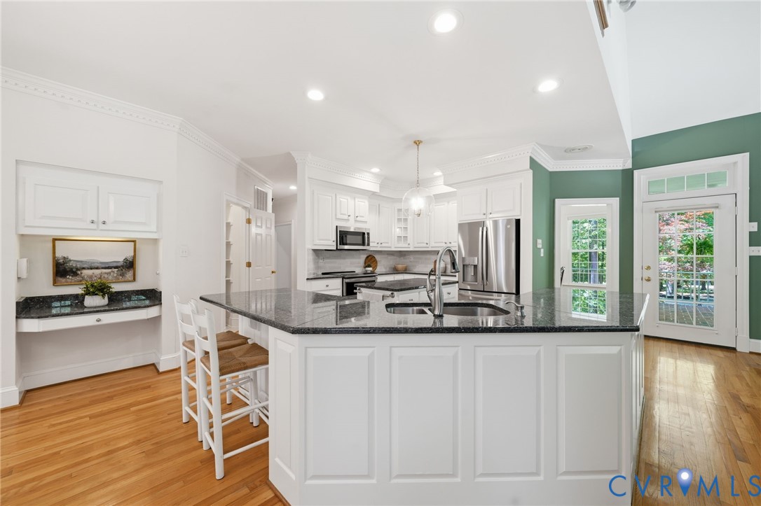 10424 Windam Hill Road Glen Allen, VA 23059 - Photo 21 of 69 a kitchen with stainless steel appliances kitchen island granite countertop a sink and cabinets