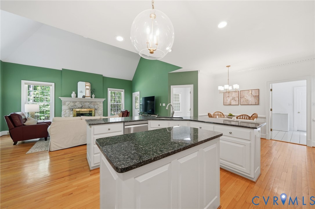 10424 Windam Hill Road Glen Allen, VA 23059 - Photo 25 of 69 a kitchen with stainless steel appliances granite countertop a sink dishwasher and a refrigerator with wooden floor