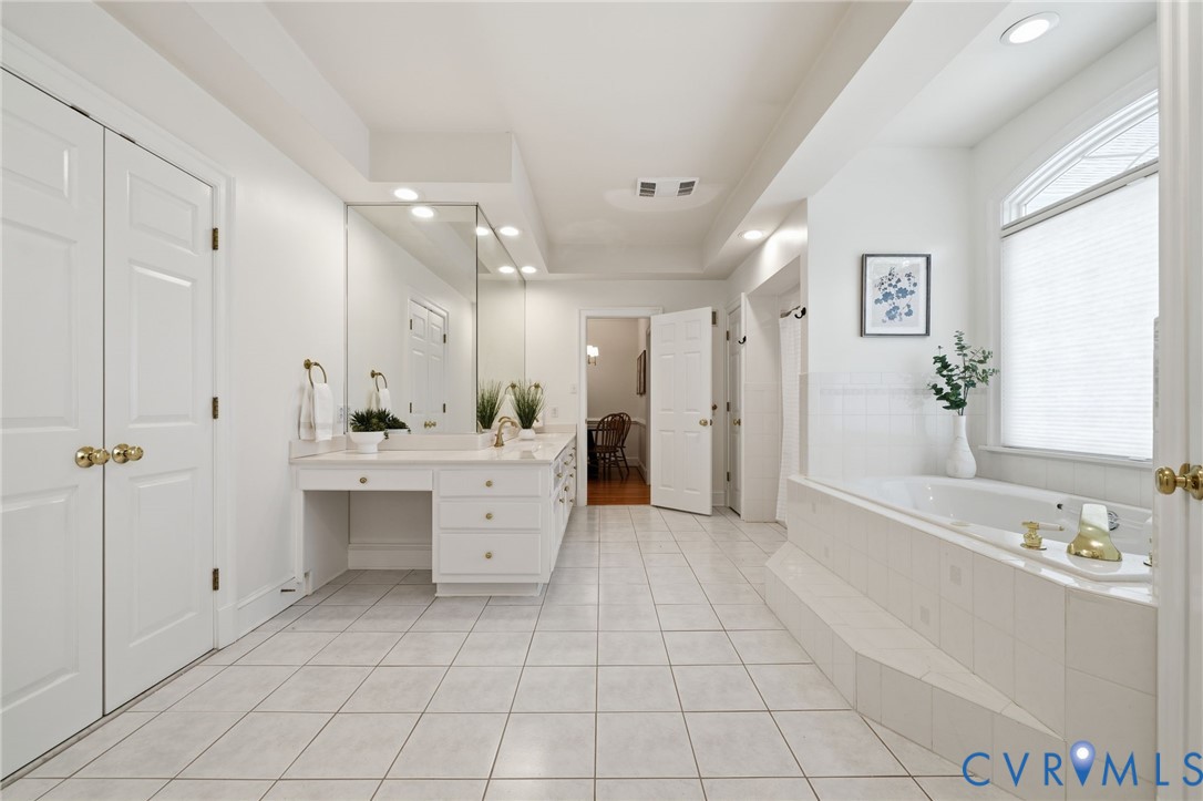 10424 Windam Hill Road Glen Allen, VA 23059 - Photo 30 of 69 a large white bathroom with a granite countertop sink mirror and bathtub