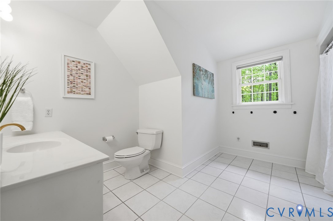10424 Windam Hill Road Glen Allen, VA 23059 - Photo 40 of 69 a bathroom with a sink a toilet and a window