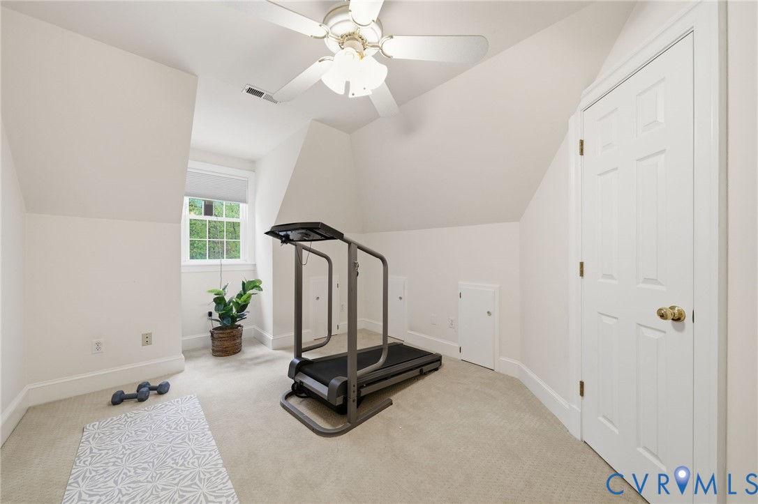 10424 Windam Hill Road Glen Allen, VA 23059 - Photo 42 of 69 a room with gym equipment and a chandelier