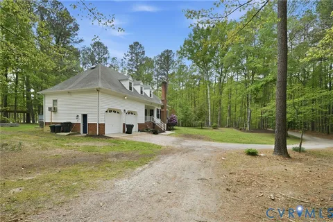 a front view of a house with a garden and porch