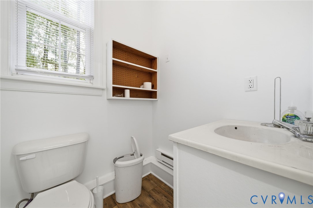 10424 Windam Hill Road Glen Allen, VA 23059 - Photo 54 of 69 a bathroom with a toilet a sink and a window