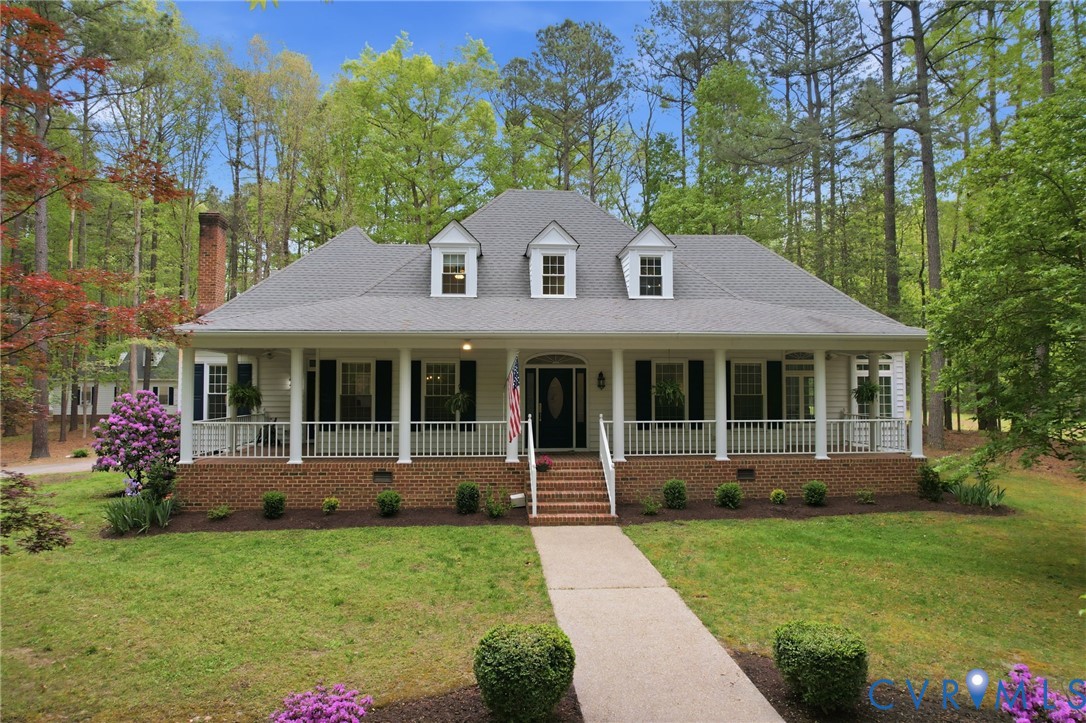 10424 Windam Hill Road Glen Allen, VA 23059 - Photo 61 of 69 a front view of a house with a garden and porch