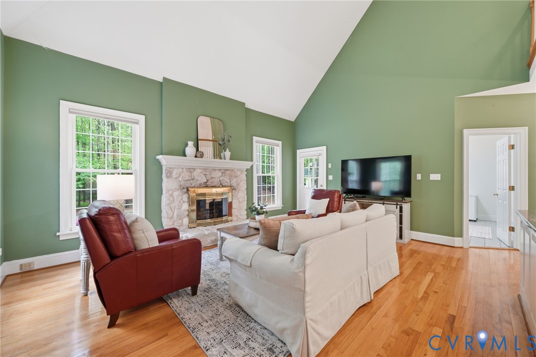 10424 Windam Hill Road Glen Allen, VA 23059 - Photo 10 of 69 a living room with furniture a flat screen tv and a fireplace