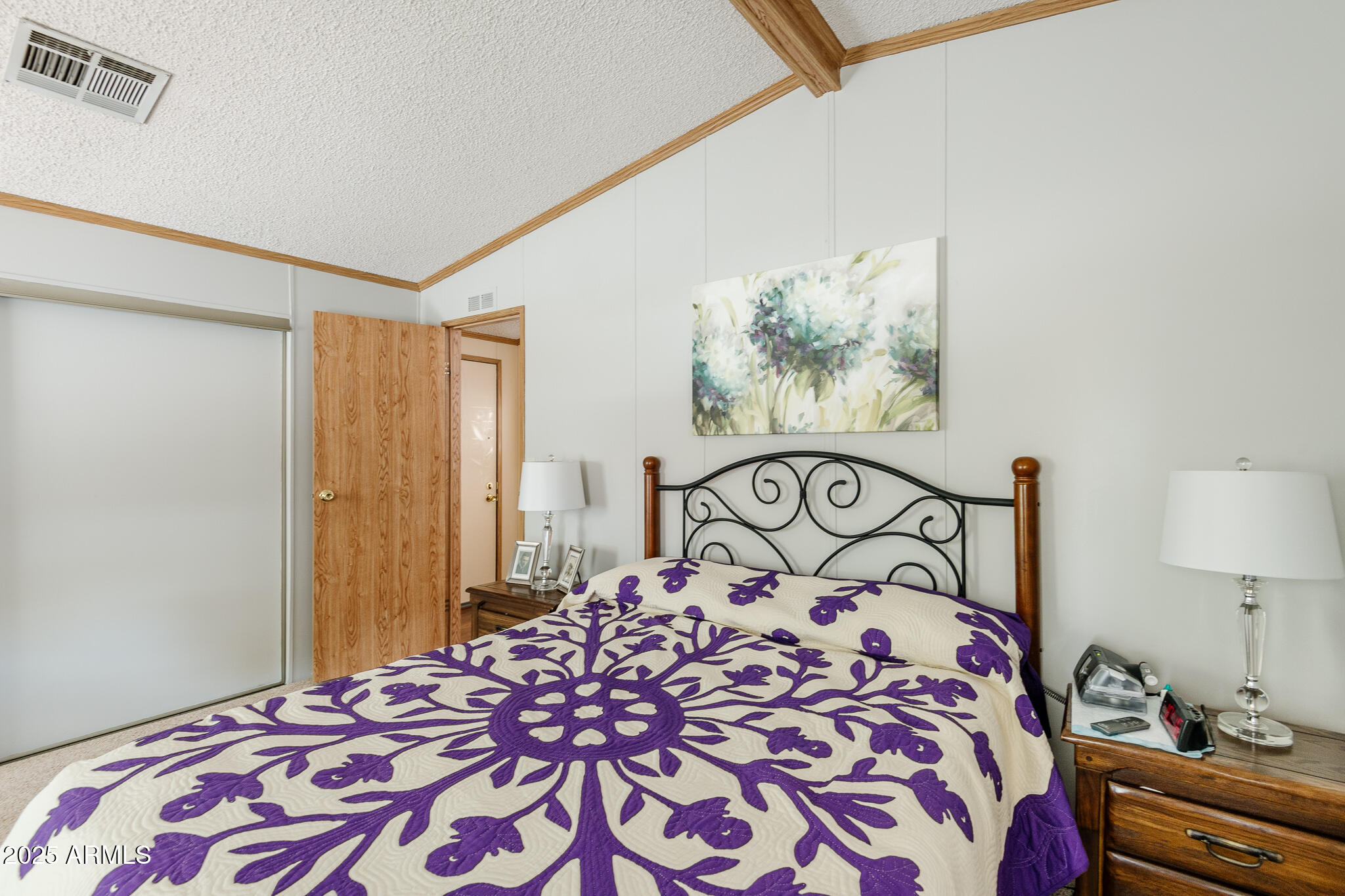 6770 West State Rte 89A, Unit 41 Sedona, AZ 86336 - Photo 17 of 31 a bedroom with a bed and a lamp on dresser