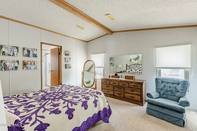 a bedroom with a bed and dresser