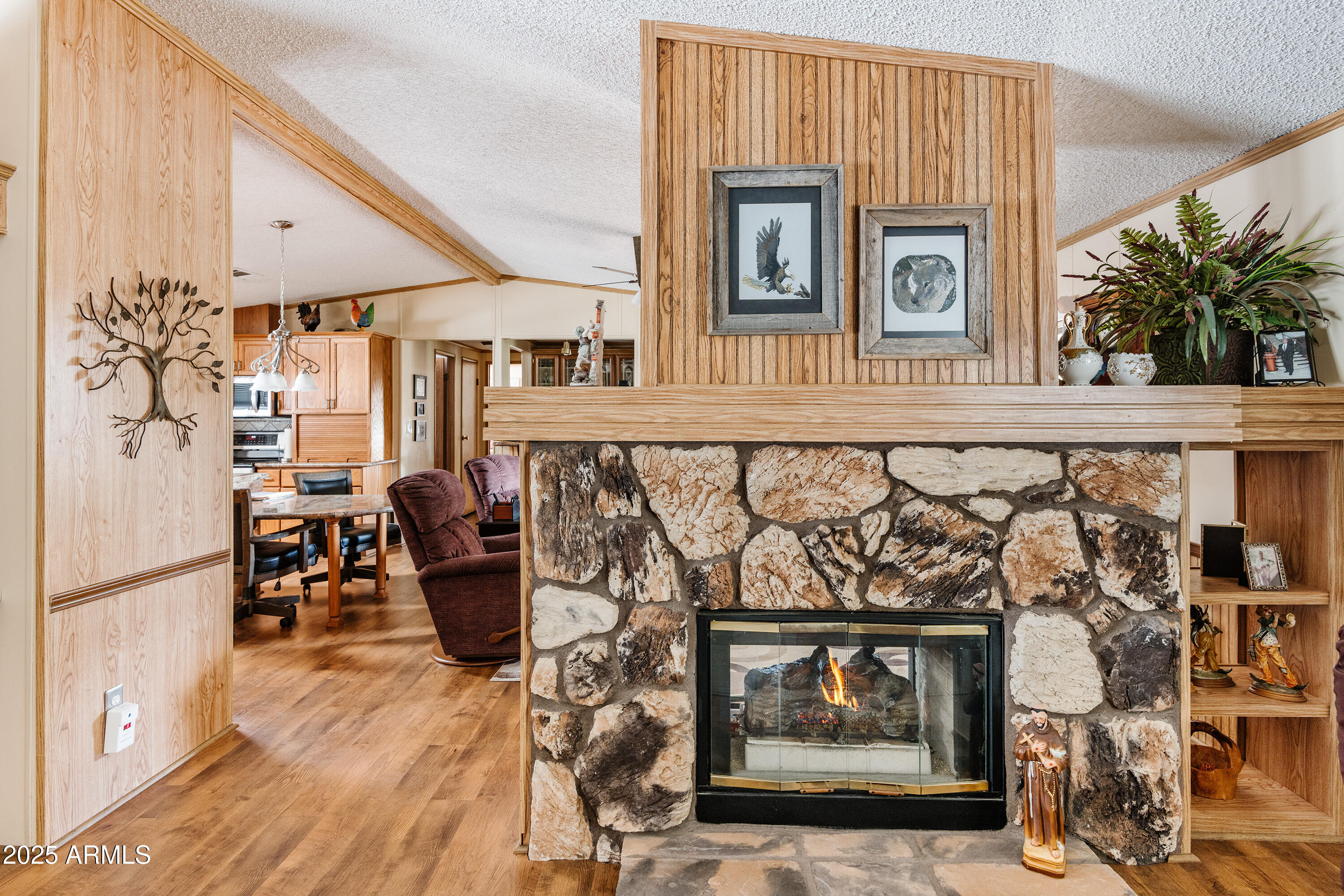 6770 West State Rte 89A, Unit 41 Sedona, AZ 86336 - Photo 19 of 31 a living room with furniture and a fireplace