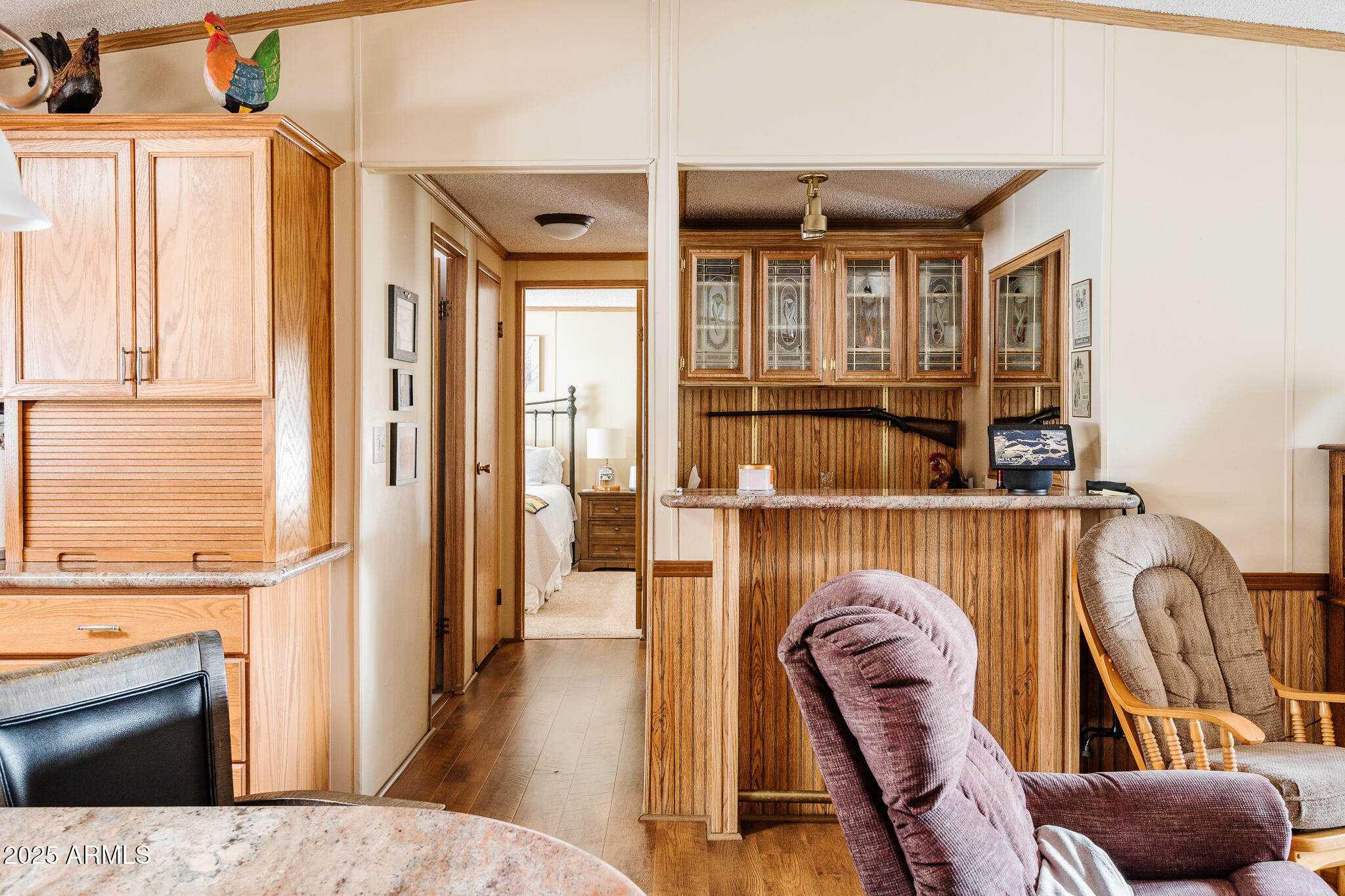 6770 West State Rte 89A, Unit 41 Sedona, AZ 86336 - Photo 24 of 31 a view of living room kitchen with furniture and wooden floor