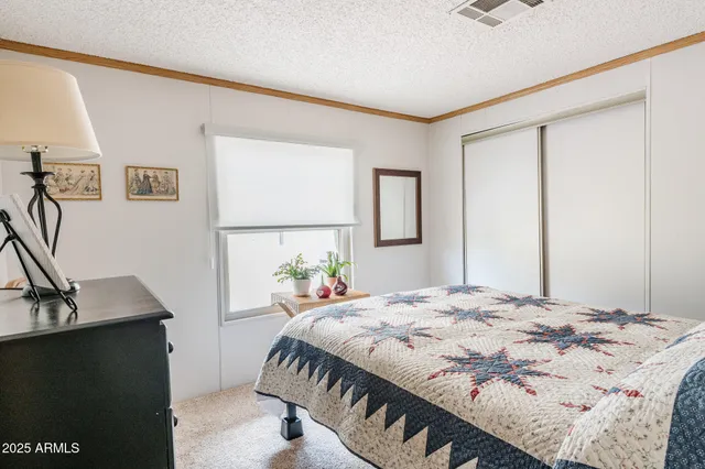 a bedroom with a bed and a sink