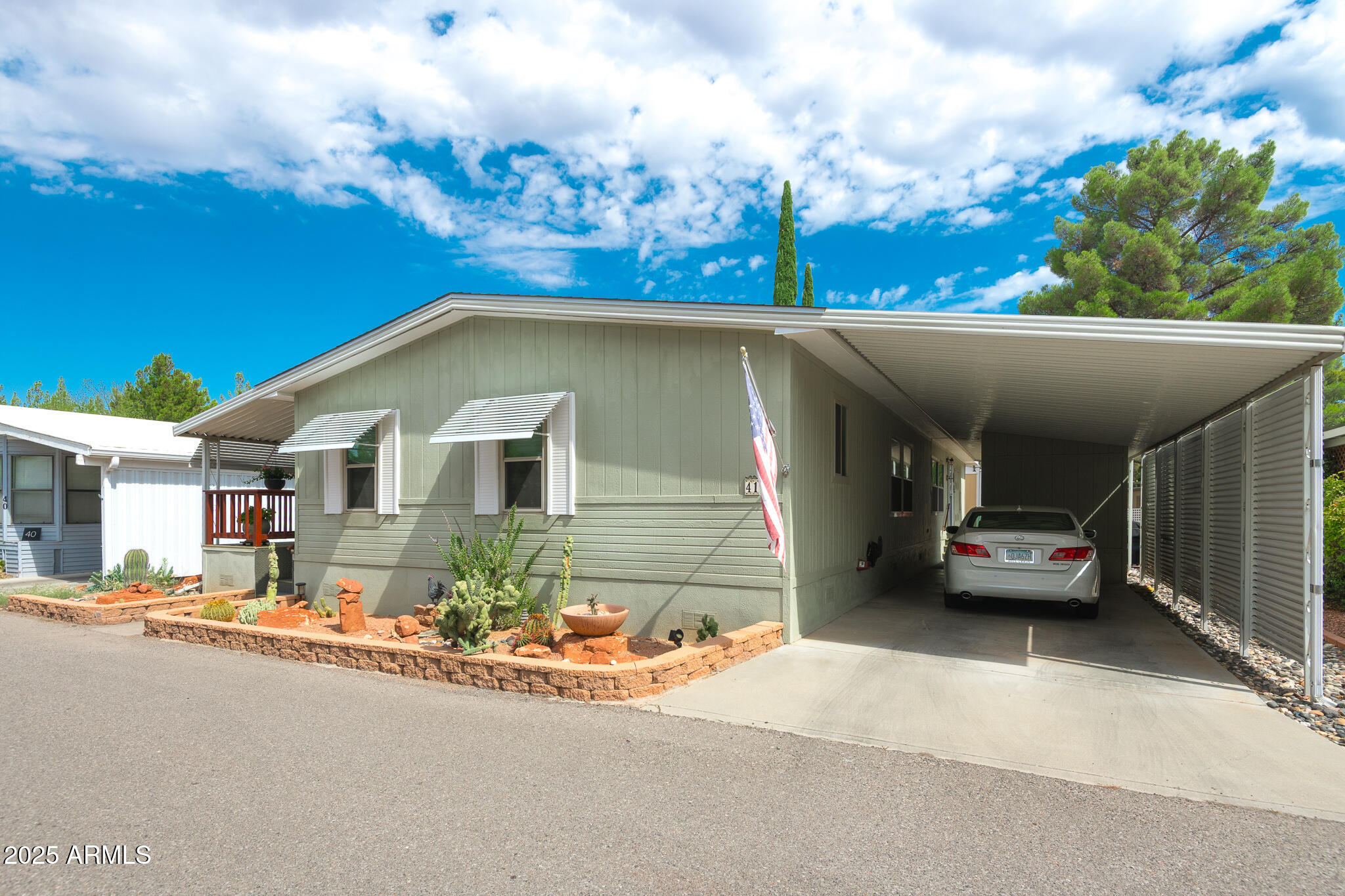 6770 West State Rte 89A, Unit 41 Sedona, AZ 86336 - Photo 3 of 31 a front view of a house with a yard