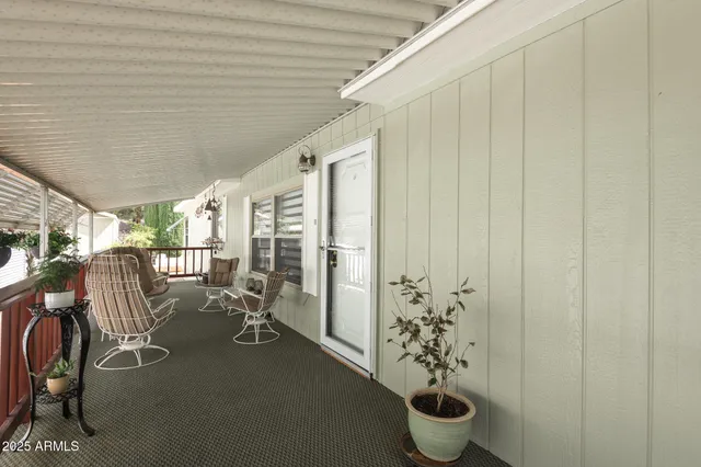 a view of a porch with dining area