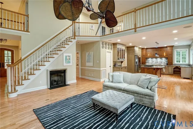 a living room with furniture fireplace and a rug