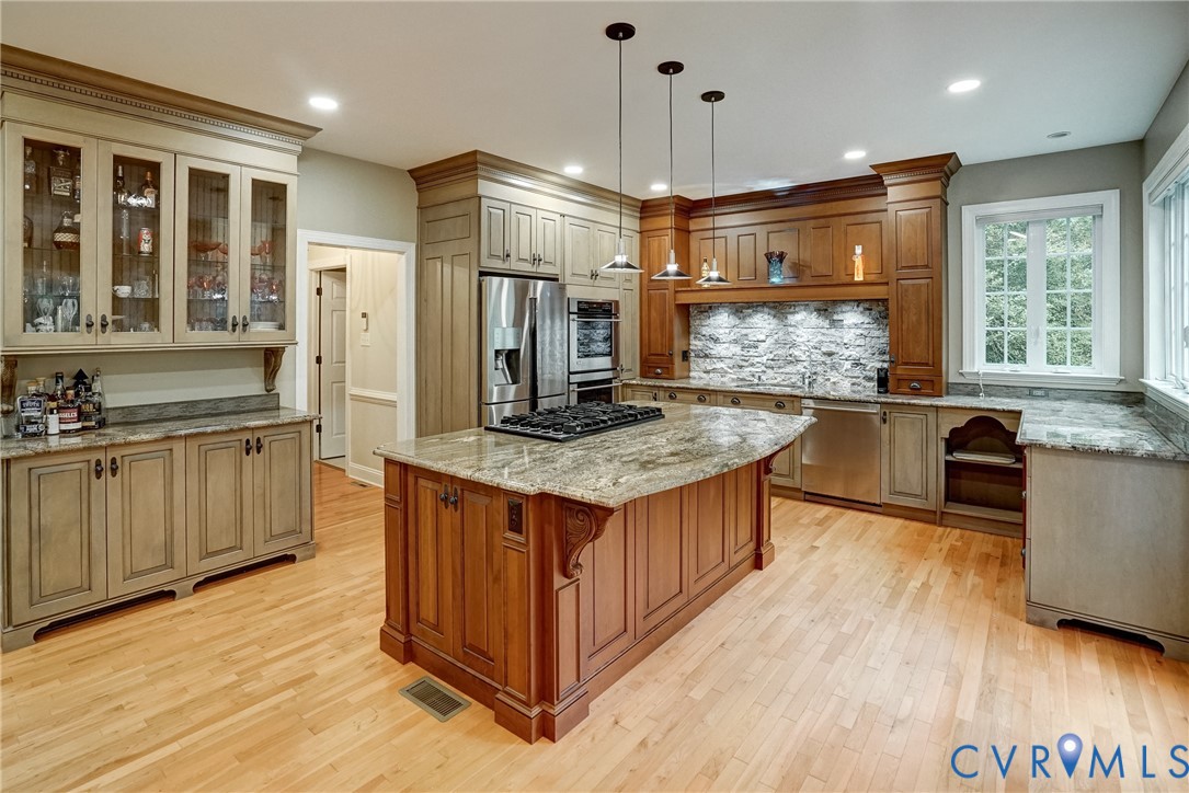 11600 Park Branch Lane Chesterfield, VA 23838 - Photo 15 of 47 a kitchen with stainless steel appliances granite countertop a stove and a refrigerator