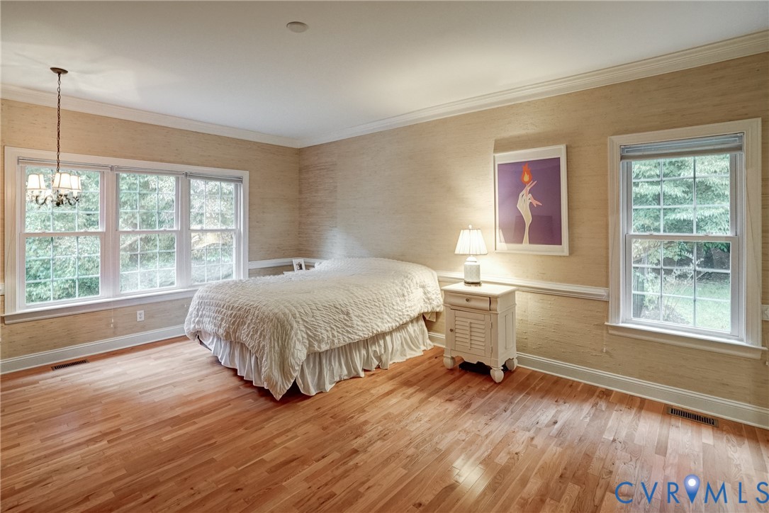 11600 Park Branch Lane Chesterfield, VA 23838 - Photo 23 of 47 a spacious bedroom with a bed and wooden floor